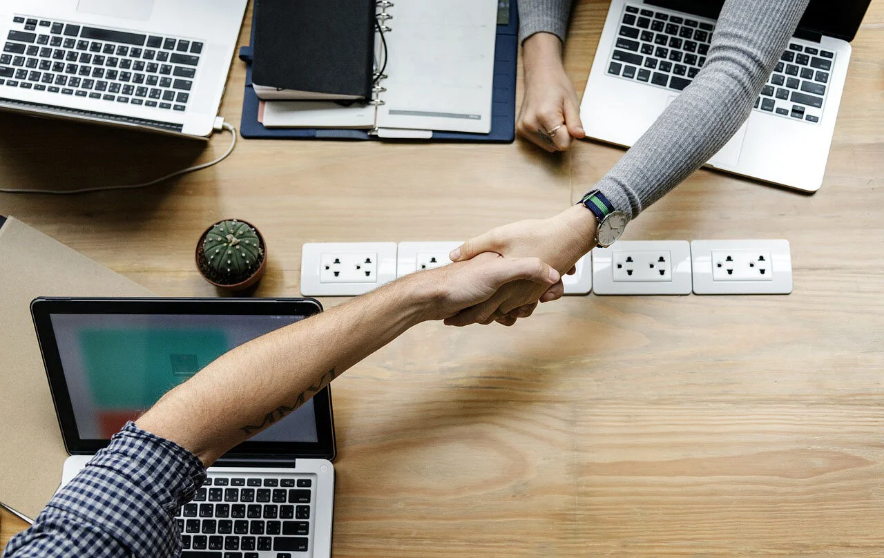 Handshake at closing